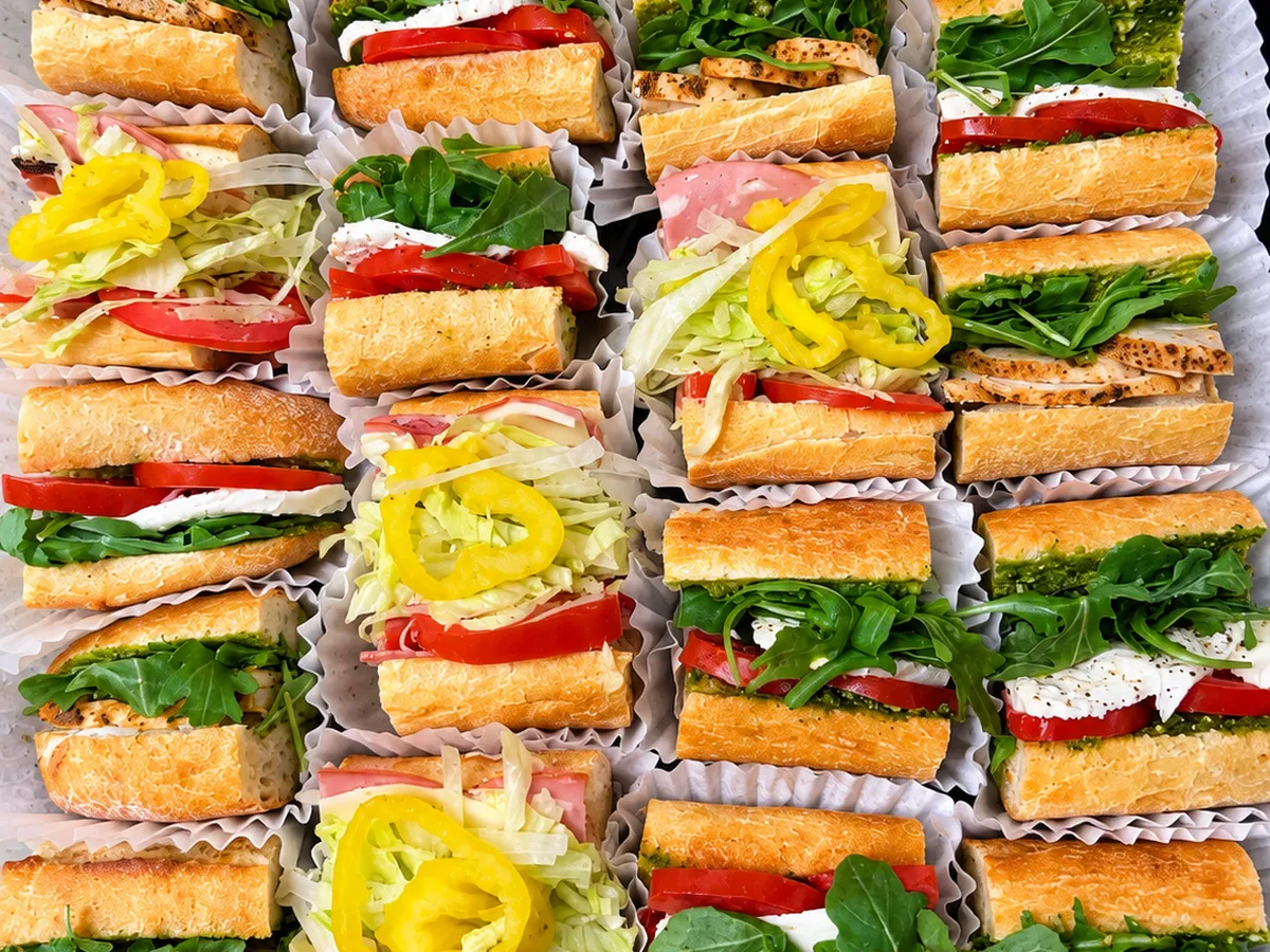 A Piknik platter of baguette sandwiches, cut and arranged